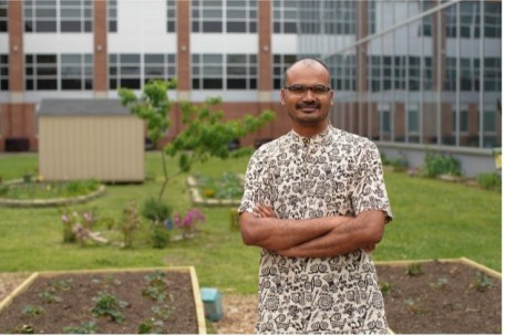 Dr. Balasubramani Karuppusamy standing in a garden at North Carolina Central University, where he volunteered with the Community Health Coalition.