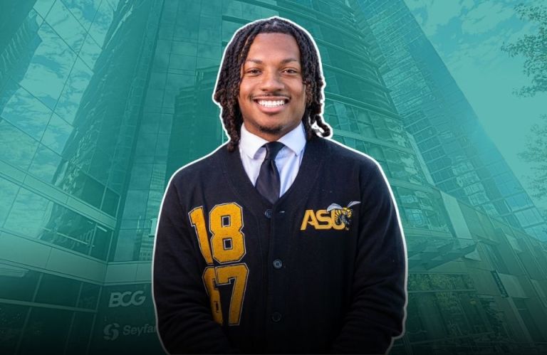 Michael Stallworth Jr. smiling in front of the PwC building, wearing an Alabama State University cardigan.