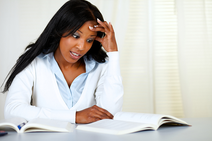 Stressed College Student focused on how to study and avoid cramming for her exam