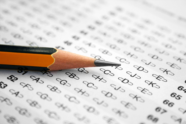 Close up of pencil on answer sheet for college entrance exam.