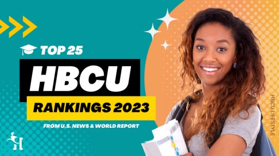 A female African American HBCU student poses while smiling and holding her book in her arms.