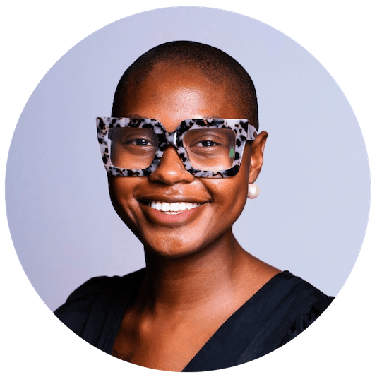 Jessica Watson, HBCU University Relationship Manager at Fidelity Investments, smiling confidently with bold patterned glasses and a professional outfit.