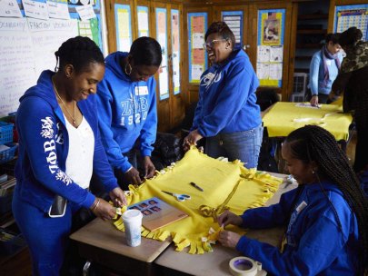 Members of Zeta Phi Beta Sorority put in Community service time at a Harlem school on MLK Day