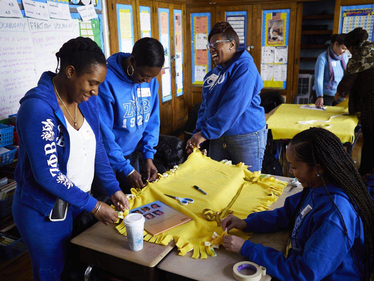 Members of Zeta Phi Beta Sorority put in Community service time at a Harlem school on MLK Day